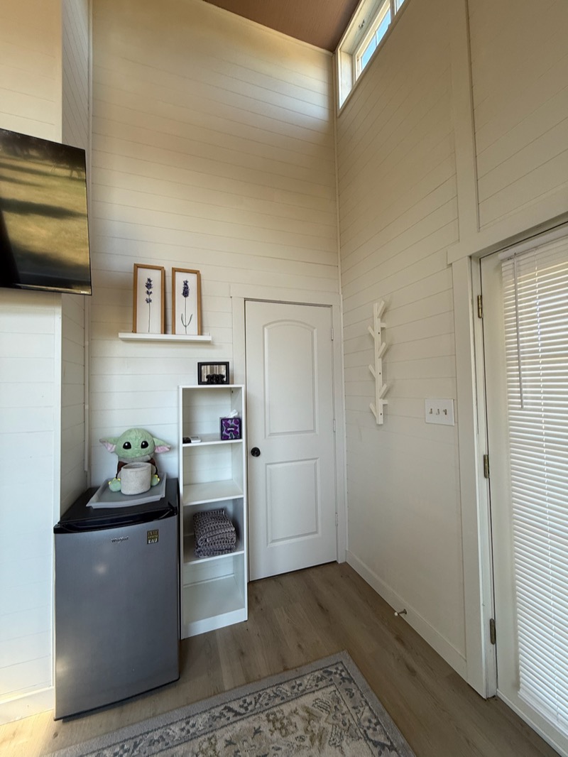 Cabin amenities with mini fridge and TV